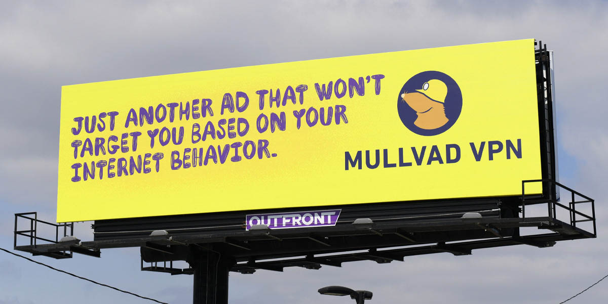 Yellow Mullvad VPN billboard: JUST ANOTHER AD THAT WON'T TARGET YOU BASED ON YOUR INTERNET BEHAVIOR. MULLVAD VPN.