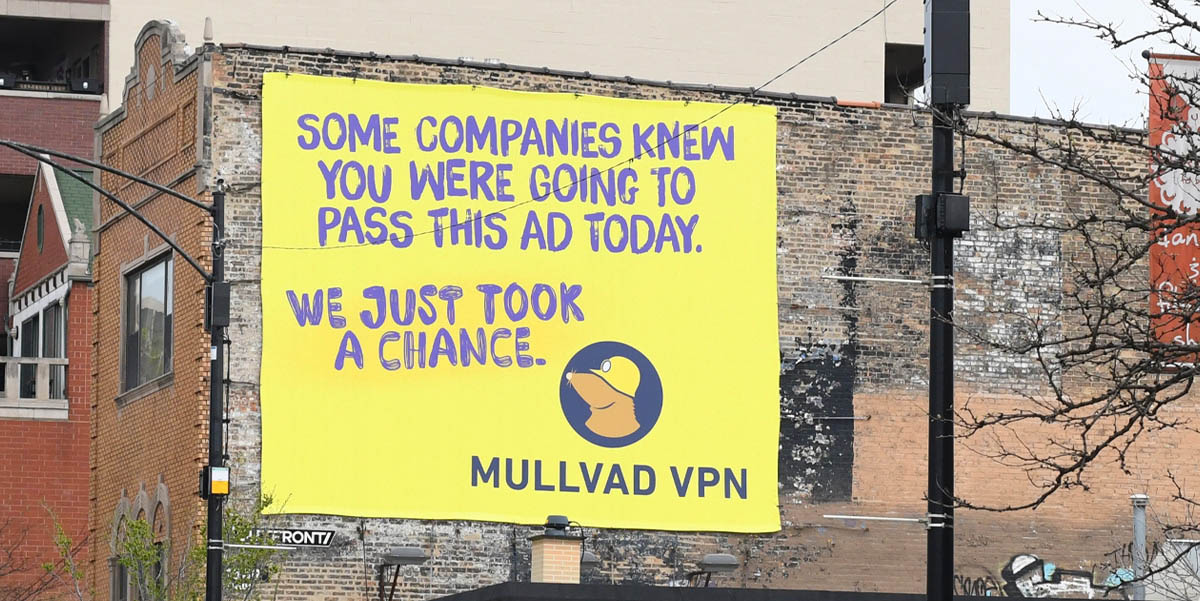 Mullvad VPN yellow wall advertisement: SOME COMPANIES KNEW YOU WERE GOING TO PASS THIS AD TODAY. WE JUST TOOK A CHANCE. MULLVAD VPN